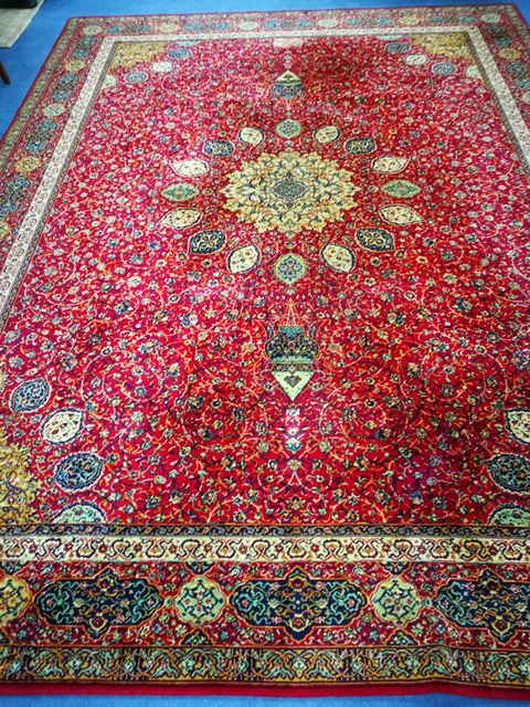 A Wilton Persian design red ground carpet 364 x 274cm